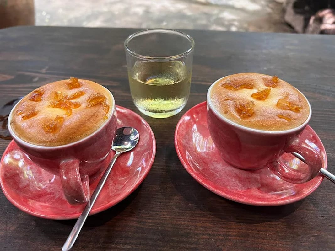 Artisanal egg coffee preparation using locally sourced ingredients and premium coffee beans